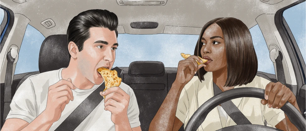 Two friends are driving in a car while eating pizza trying to be a better friends
