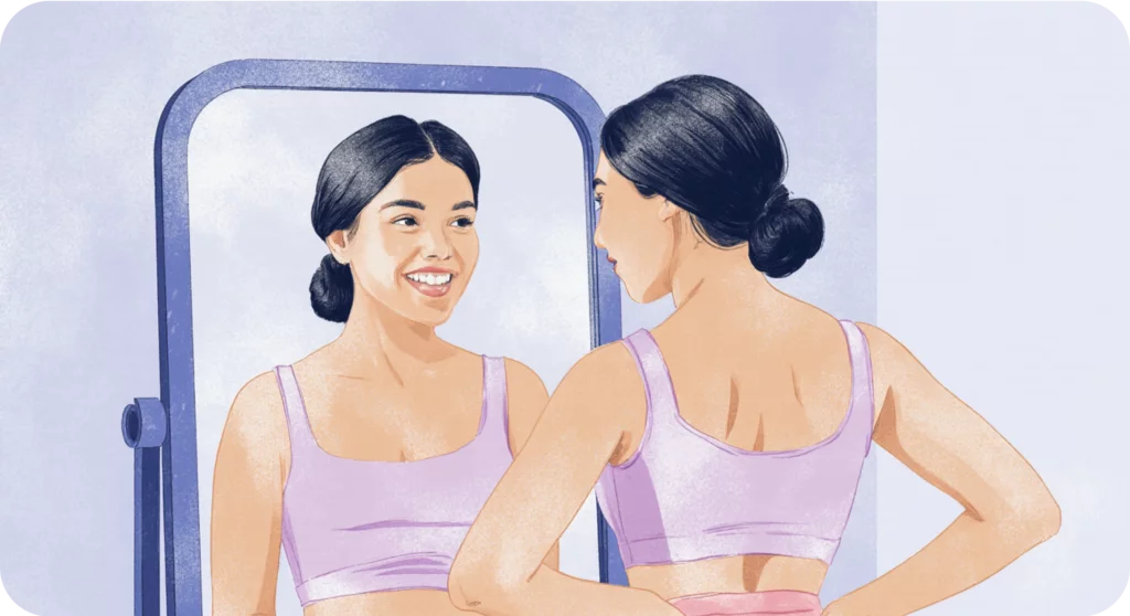 Girl looks in the mirror and smiles because she learned how to overcome BPD splitting