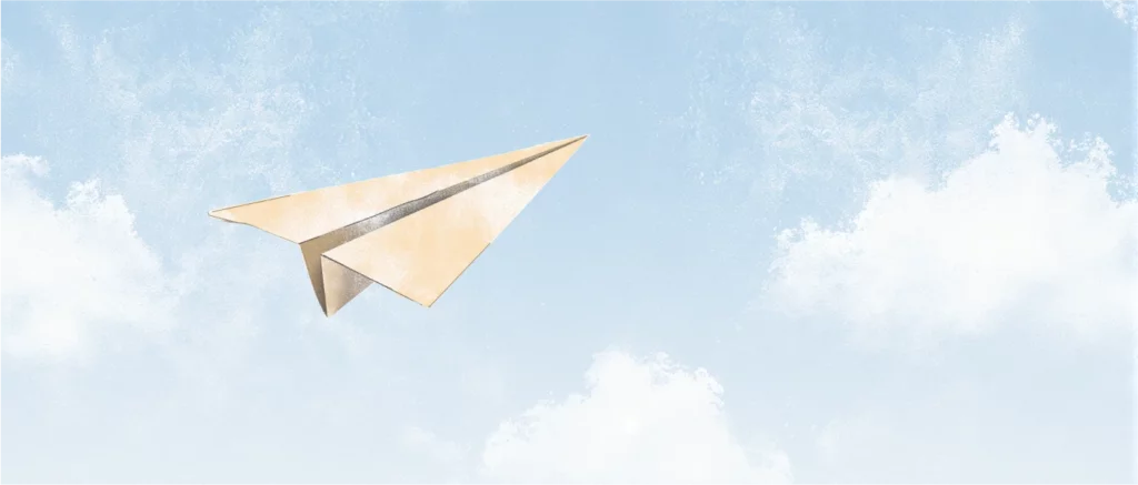 Paper airplane flying as a metaphor for feeling like a failure